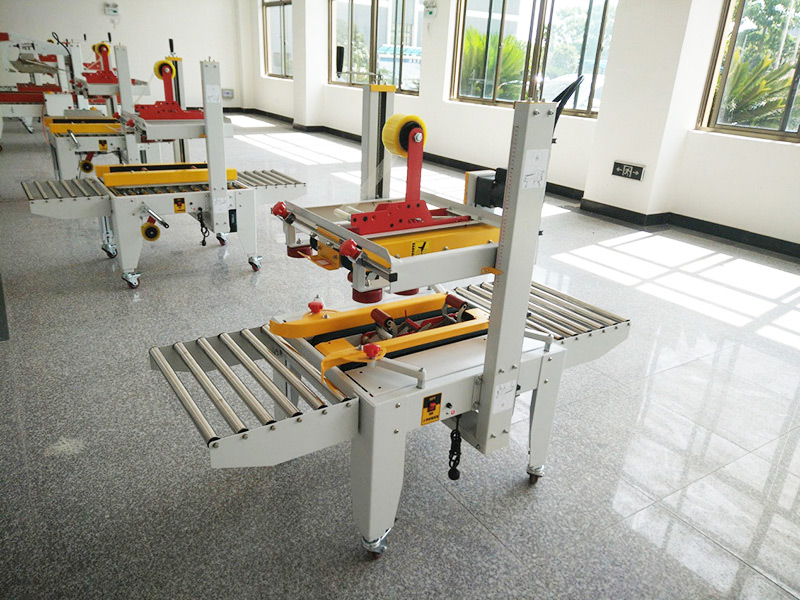 JS-FX500C 上下驅(qu)動手動(dòng)折蓋膠(jiao)帶封箱(xiāng)機